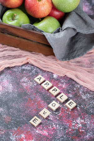 Juicy fresh apples in a wooden rustic trayの写真素材