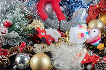 Festive decorations and Santa figurines on dark backgroundの写真素材