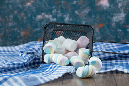 Multicolor yummy marshmallows in a mini metallic basketの写真素材