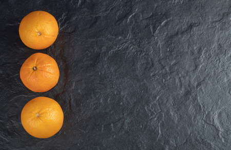 Set of fresh orange fruits with isolated on a black backgroundの写真素材
