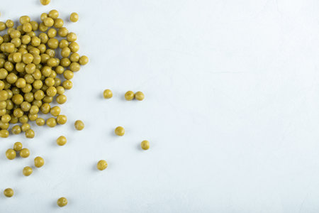 Top view. Healthy snack. Marinated green olives on white background