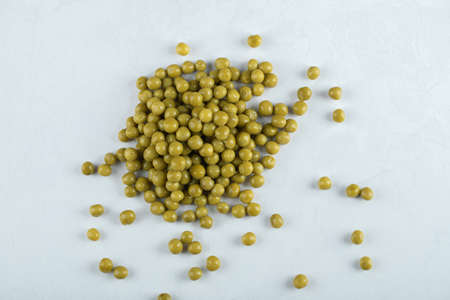 Top view. Pile of green olives on white background