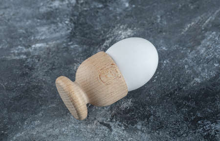 Close up photo of egg on grey background