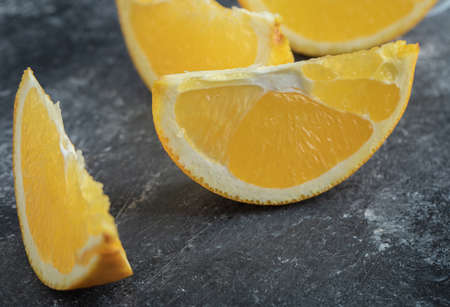 Sliced fresh orange on marble background