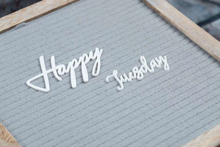 Happy weekdays poster written with letter symbols on the grey tissueの写真素材