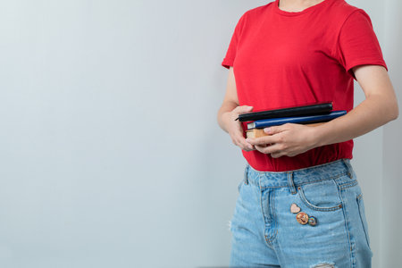Female student holding her school books