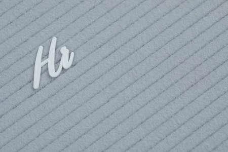 Hi phrase embedded on a grey tissue