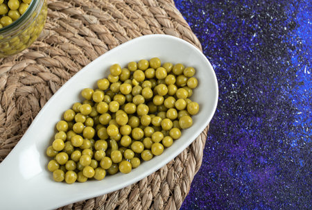 Close up photo of marinated olives in white bowl