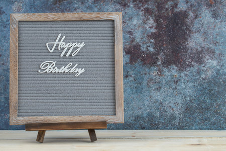Happy birthday writing on the wooden deskの写真素材