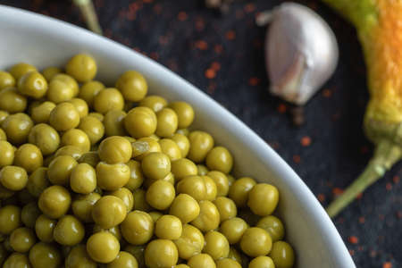Close up photo of pile of green marinated olives