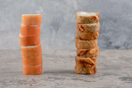 Two kinds of delicious sushi rolls placed on marble background
