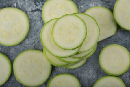 Close up photo of stack of zucchini slicesの写真素材