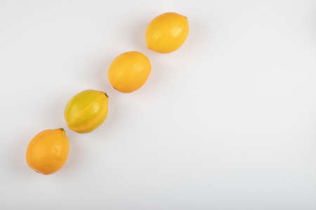 Fresh yellow lemons isolated on white backgroundの写真素材
