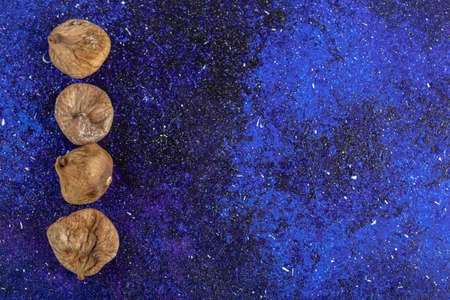 Dried natural figs on blue backgroundの写真素材