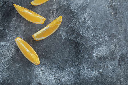 Sliced fresh orange on marble backgroundの写真素材