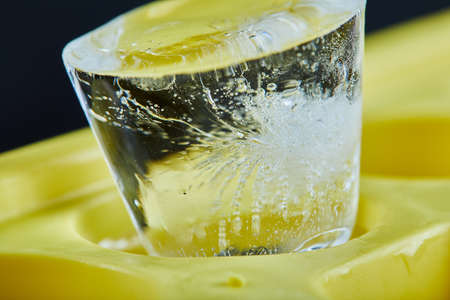 Ice cube on dark background