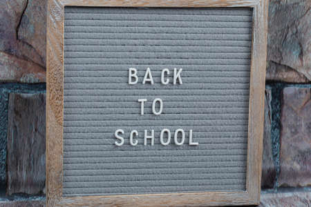 Back to school phrase embedded on grey background