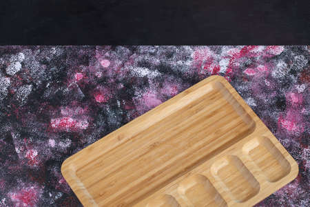 Square breakfast platter with carved pieces on itの写真素材