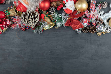 Christmas dark background with ornaments and figurinesの写真素材