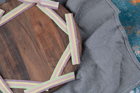 Rainbow gum jellies on a wooden board