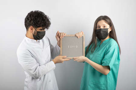 Couple is arguing about possession of modern computerの写真素材