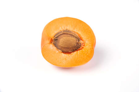 A half cut peach isolated on white background