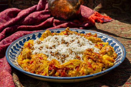 Traditional caucasian rice dish plov with omlette and lentils