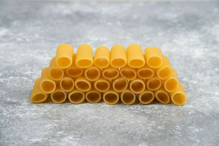 Penne pasta stock on a marble background