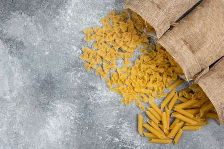 raw pasta in bagging sack. soft image, room for textの写真素材