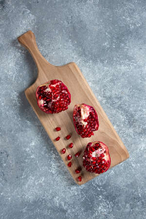Ripe pomegranates on a concrete background. Still life. View from above.の写真素材