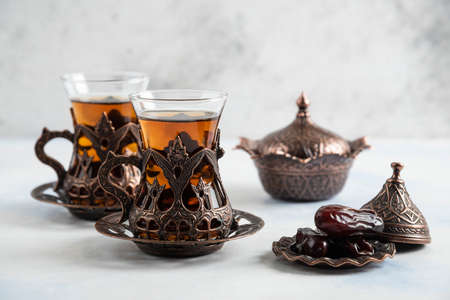 Close up photo of Turkish tea and dry dateの写真素材