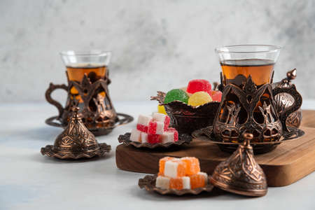 Horizontal photo of Turkish tea table. Fragrant tea and Candiesの写真素材