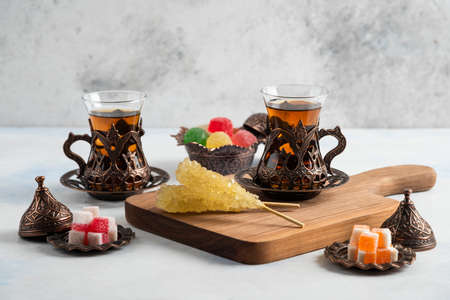 Sweet candies and fragrant teas. Traditional tea set. High quality photoの写真素材