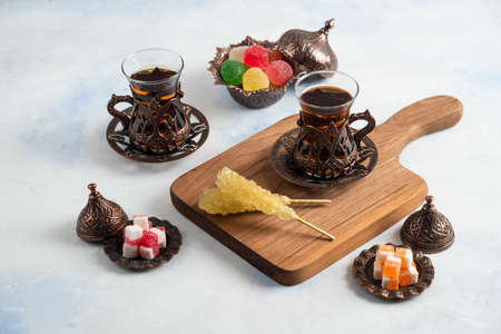 Classic Turkish tea set. Sweet candies and hot teasの写真素材
