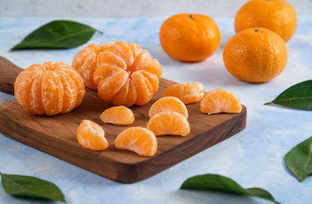 Close up photo of peeled mandarin slicesの写真素材
