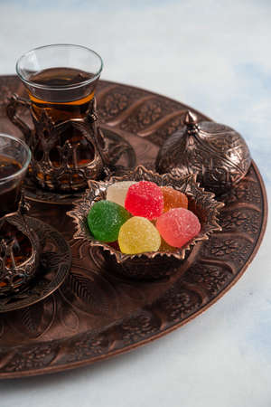 Vertical photo of Traditional tea table. Tea and marmaladeの写真素材