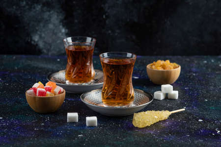 Hot Tea And sweets on blue backgroundの写真素材