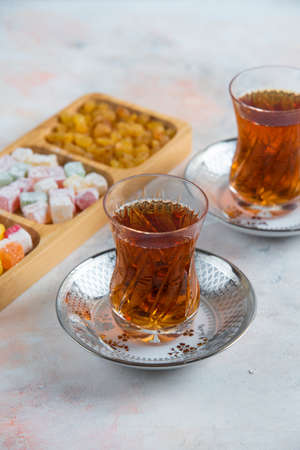 Vertical photo of Two glass tea and turkish delightsの写真素材