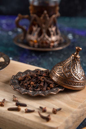 Vertical photo of dried herbs and hot teaの写真素材