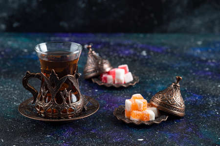 Close up photo of Hot tea and marmalade on blue backgroundの写真素材