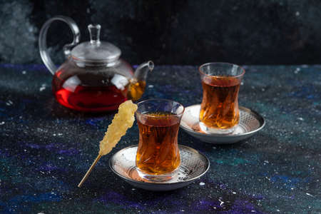 Close up photo of tea table. Teapot and two glass teaの写真素材