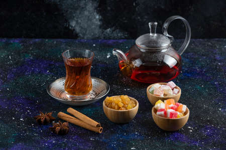 Fragrant tea and delights on blue backgroundの写真素材
