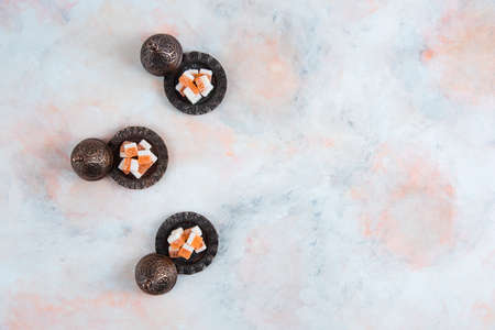 Top view of Candy crockery and orange candiesの写真素材