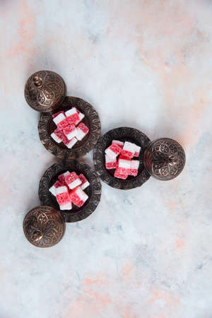 Vertical photo of Fresh jellies on crockery over white backgroundの写真素材