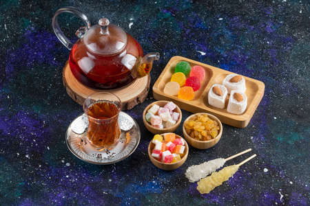 Top view of tea set . Hot tea and sweet delightsの写真素材
