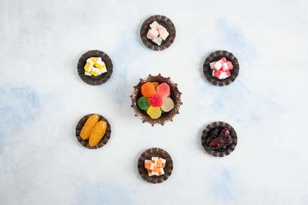 Top view of Turkish delights on white background. Candy, lokum and dry dateの写真素材