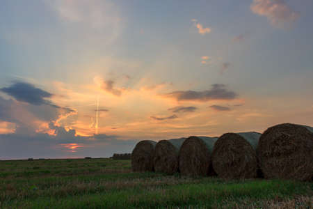 Straw bales before night