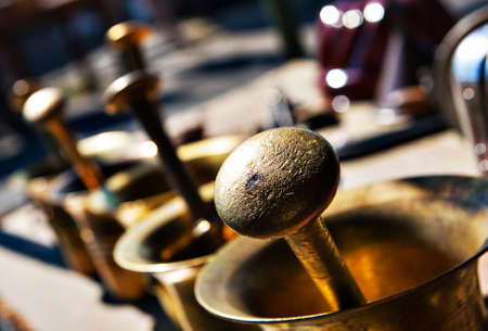 brass mortars outdoors at a market stall for saleの写真素材