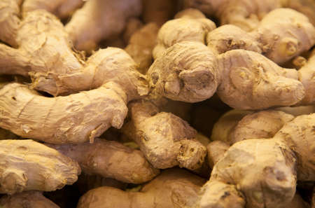 pile of organic gingers at market stallの写真素材