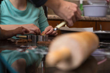 Two People Making Cookies Together At Home